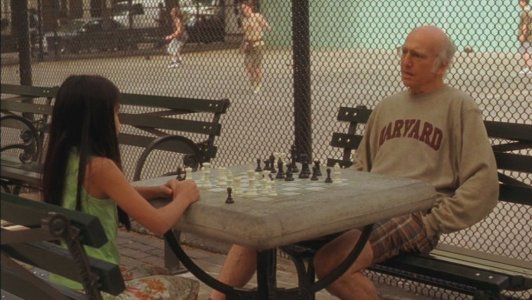 Boris dando clase de ajedrez en un parque