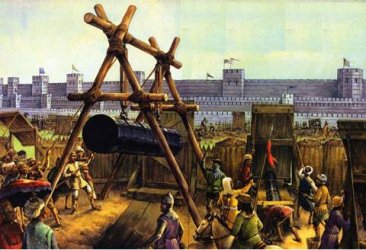 Asedio de Constantinopla. Un arma de asedio golpea unas murallas de maderas. Detrs se ven los muros de la ciudad